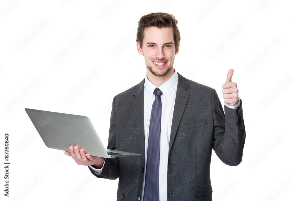 Caucasian businessman use of laptop and thumb up Caucasian businessman use of laptop and thumb up