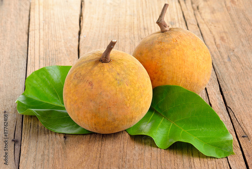 Santol fruit  on wooden  background photo