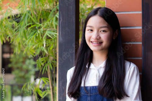 Portrait of thai student teen beautiful girl relax and smile.