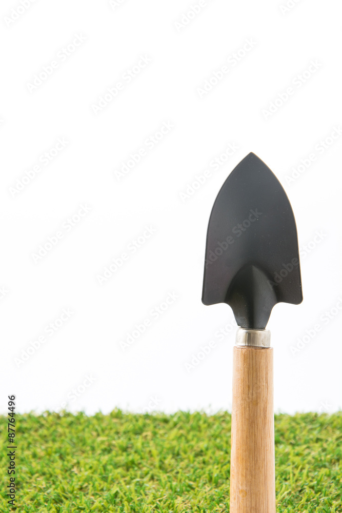green grass turf on white with spade green grass turf on white with spade
