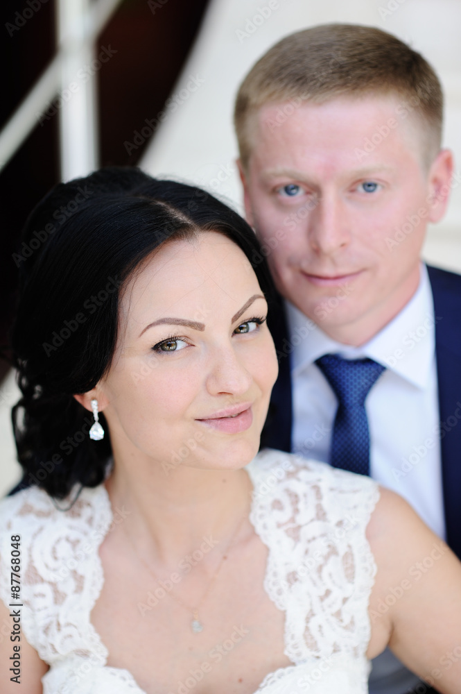 bride and groom sitting on the stairs