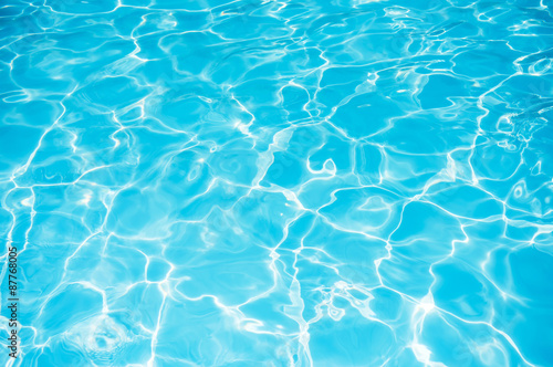 Blue water rippled background in swimming pool