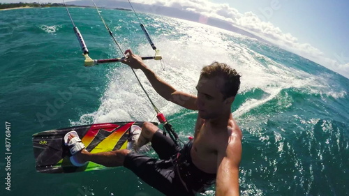 POV Shot of Kitesurfer Flying Over the Water in Hawaii. Extreme Summer Sports.