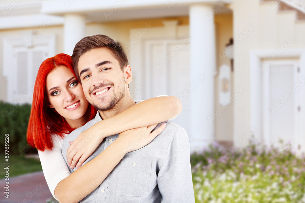 Loving couple near their house Loving couple near their house