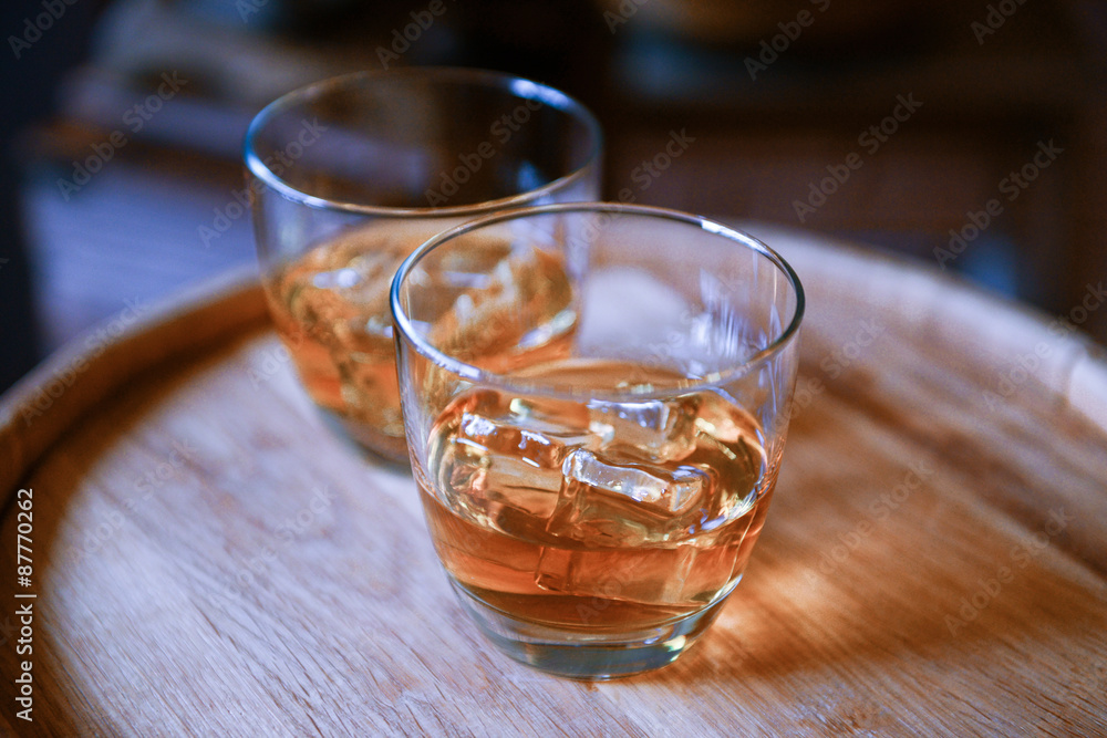Glasses of brandy in cellar, close-up Glasses of brandy in cellar, close-up