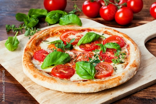 Homemade Pizza Margherita with tomatoes, mozzarella and fresh basil 