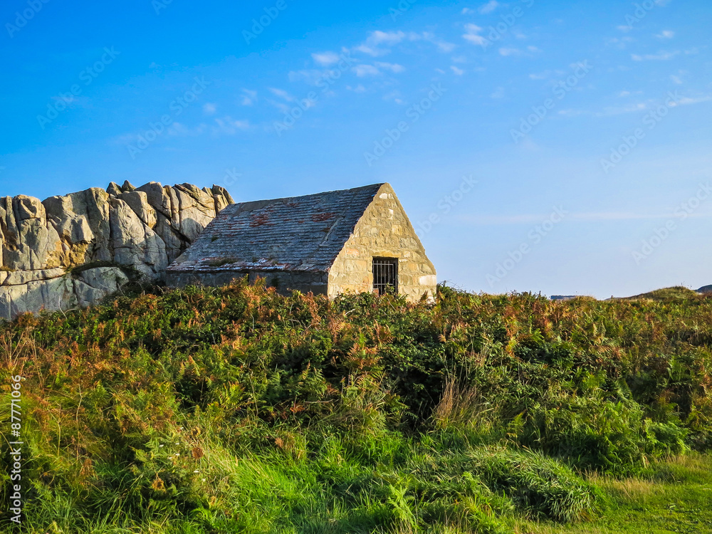 Ancient stone barn on the Guernsey island Ancient stone barn on the Guernsey island