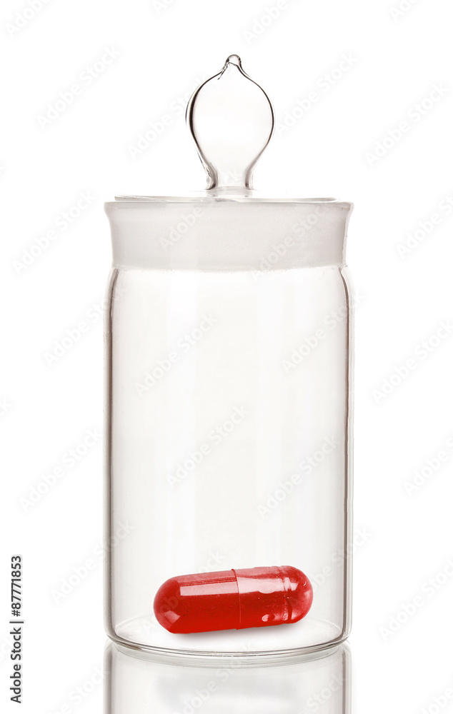 Transparent jar with pill isolated on white Transparent jar with pill isolated on white