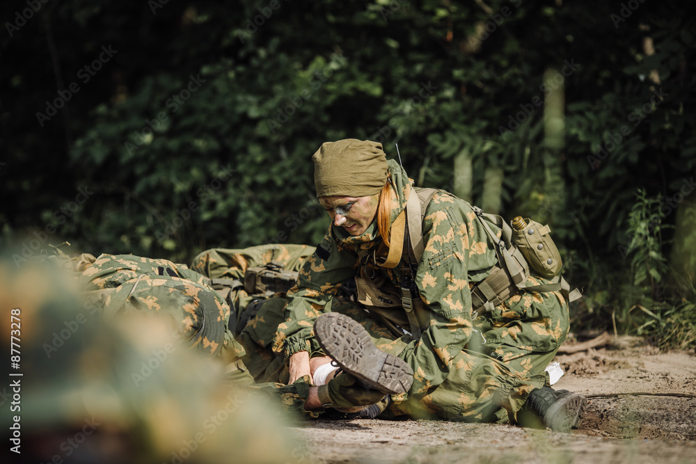 Fototapeta premium rangers team evacuate wounded comrade