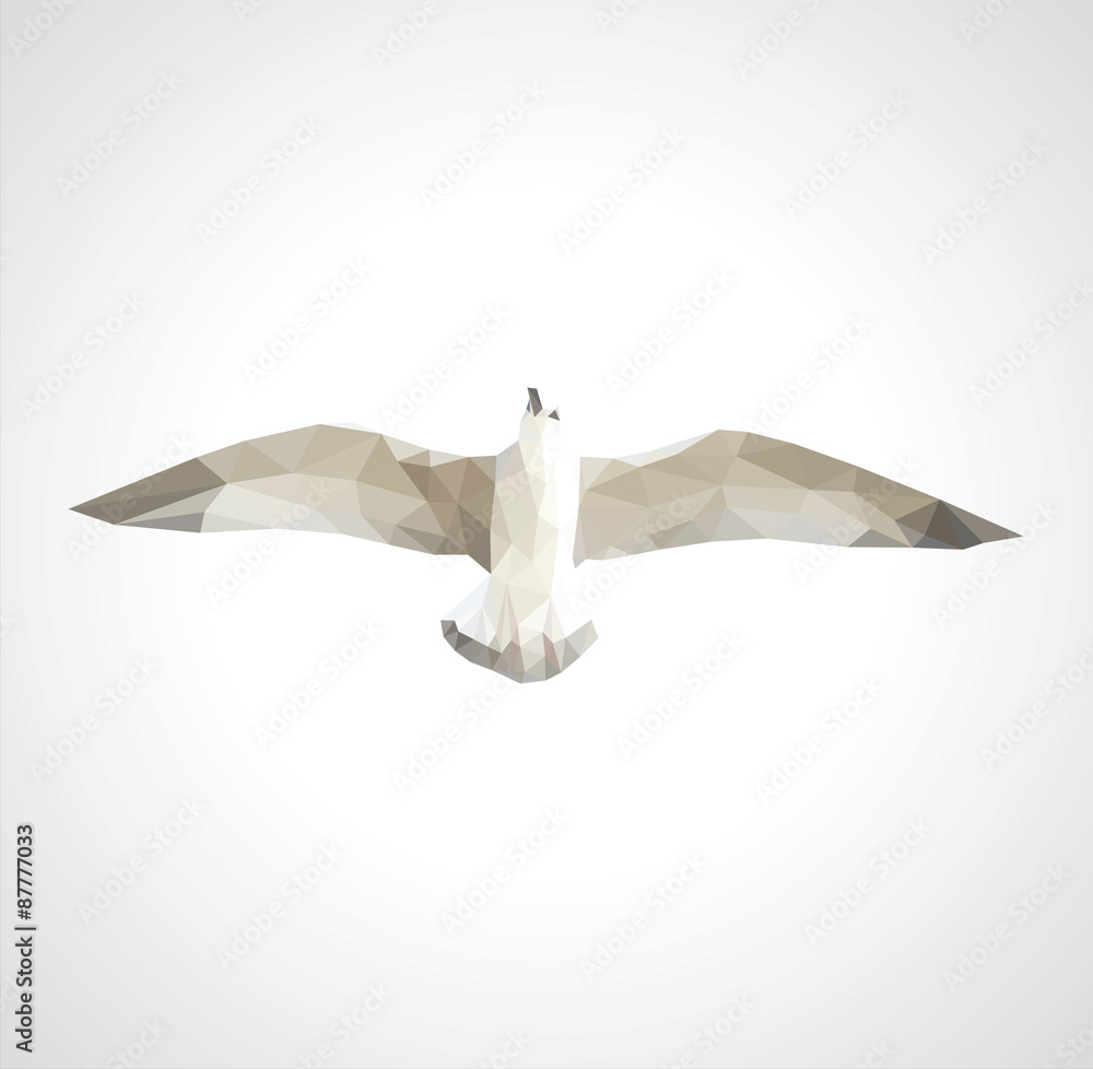 Naklejka premium polygonal seagull in flight on a white background