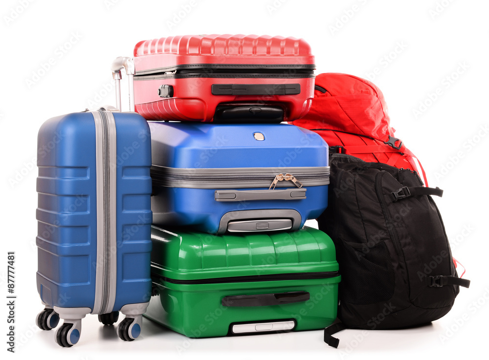 Suitcases and rucksacks isolated on white