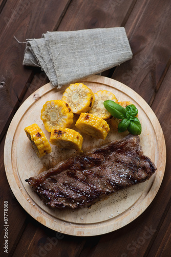 Grilled black angus steak striploin with sweet corn, top view