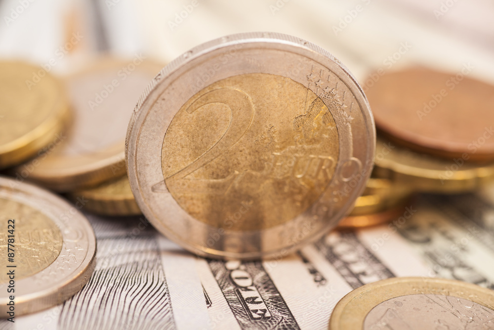 Euro coins over dollar notes Euro coins over dollar notes