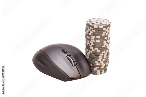 Computer mouse and pile of gambling chips. Online internet casin photo