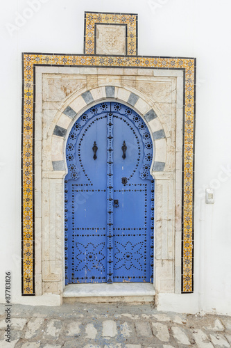 Traditional door with pattern and tiles from Sidi Bou Said, Tunisia