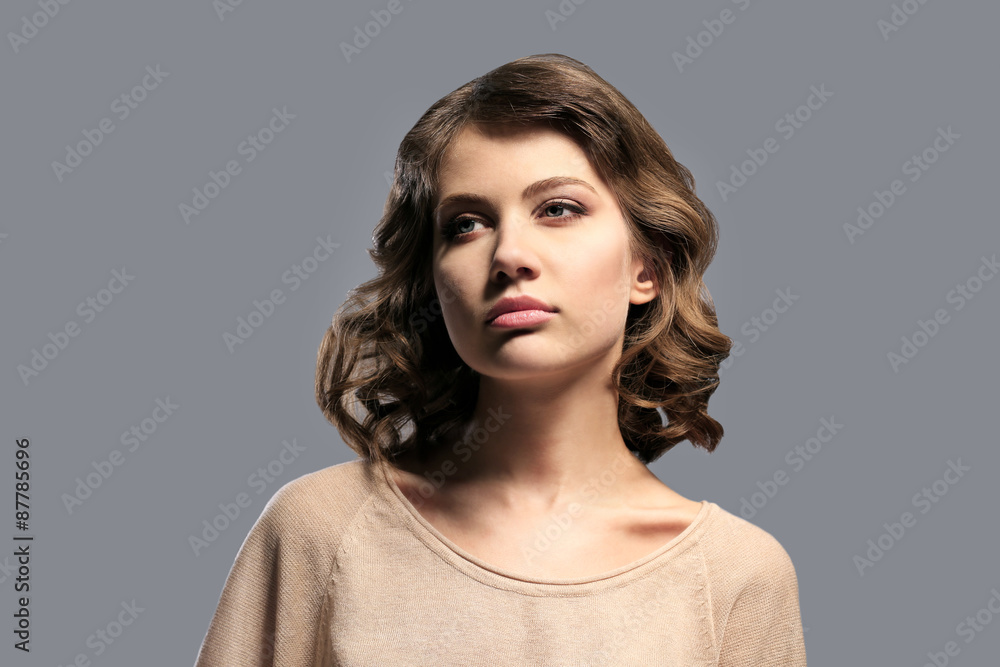 Portrait of beautiful model on gray background Portrait of beautiful model on gray background