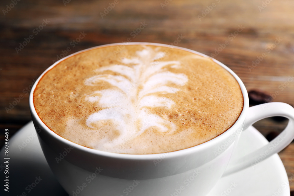 Cup of latte art coffee with grains, closeup Cup of latte art coffee with grains, closeup