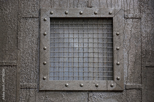 Small window with metal bars.