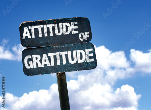 Attitude of Gratitude sign with sky background photo