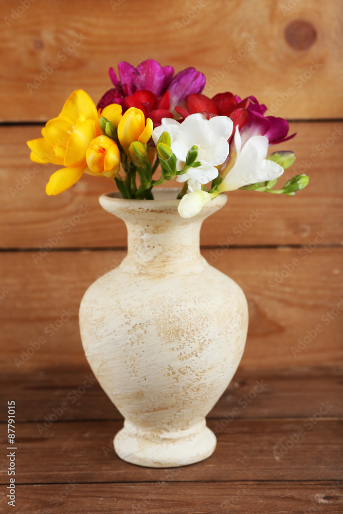 Beautiful spring flowers on wooden background Beautiful spring flowers on wooden background