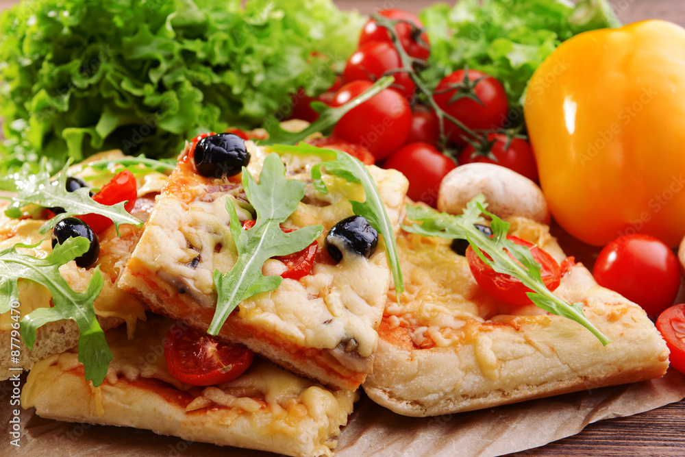 Delicious homemade pizza on table close-up Delicious homemade pizza on table close-up