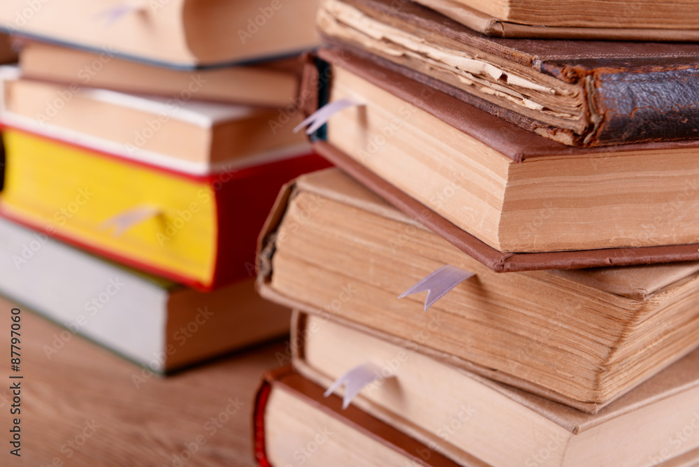 Stacks of books on table close up