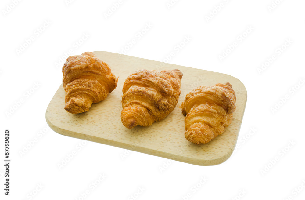 croissant on wood board