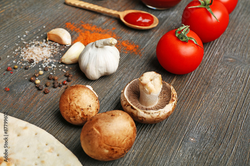 Ingredients for cooking pizza on wooden table, closeup