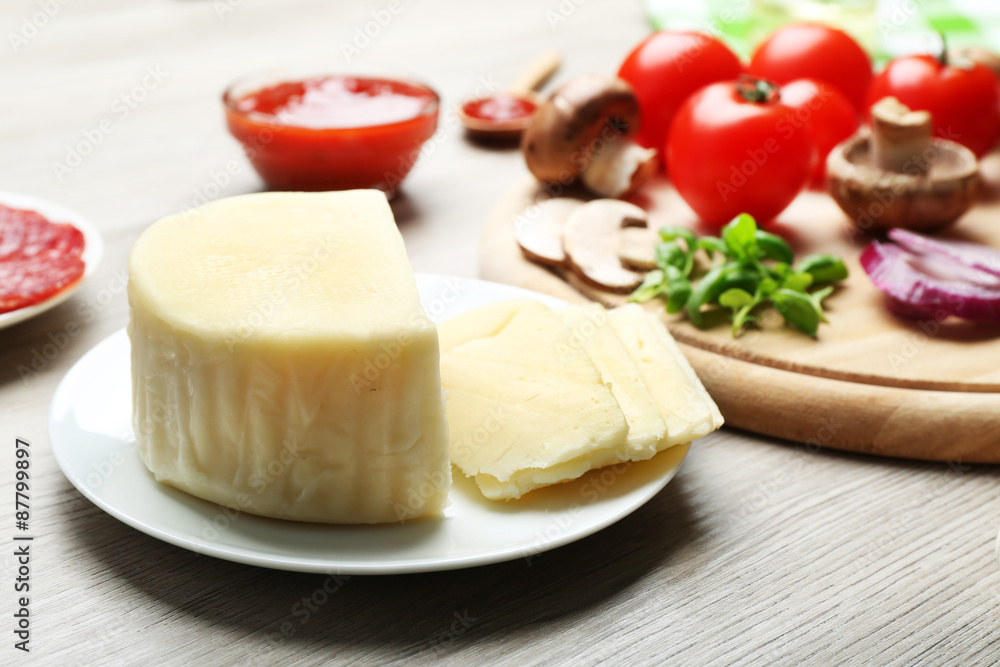 Ingredients for cooking pizza on wooden table, closeup