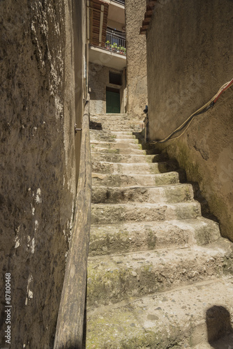 Pisciotta, Cilento, Italy. Small medieval village. Small squares, streets, stairways, Mediterranean colors, stone, bricks, doors and portals. Sky, sun and sea. 