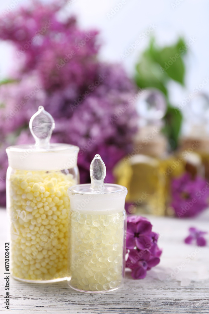Spa treatment and flowers on light background Spa treatment and flowers on light background