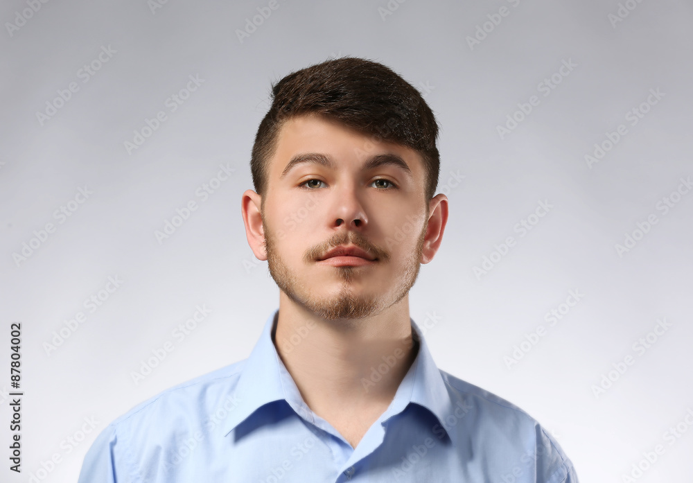 Portrait of serious man on gray background Portrait of serious man on gray background