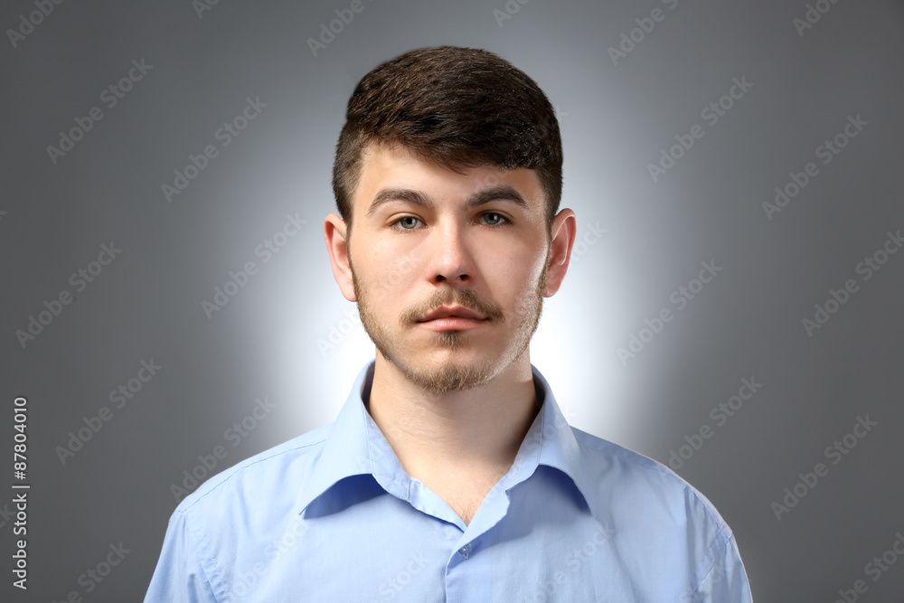 Portrait of serious man on gray background Portrait of serious man on gray background
