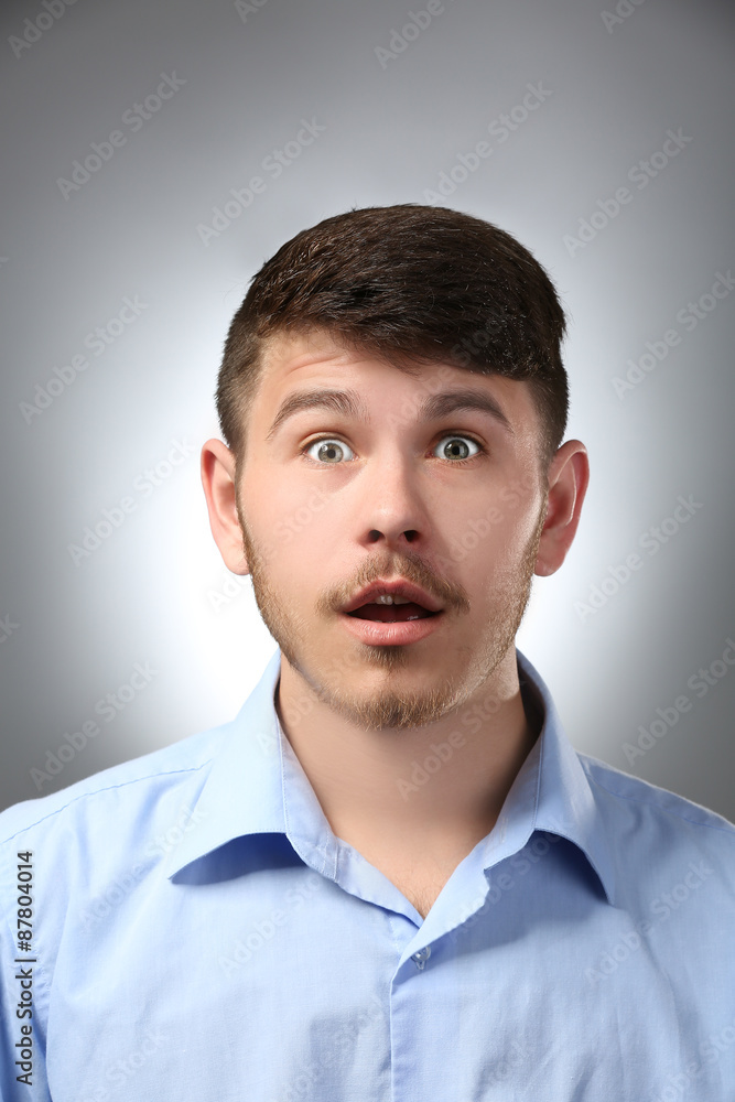 Portrait of surprised man on gray background Portrait of surprised man on gray background