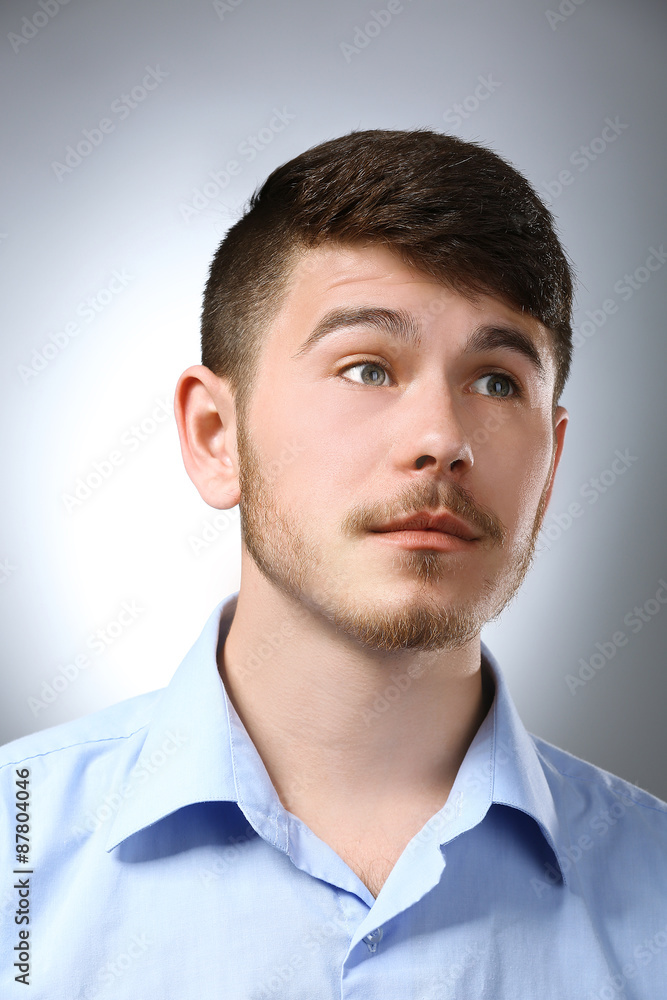 Portrait of thoughtful man on gray background Portrait of thoughtful man on gray background