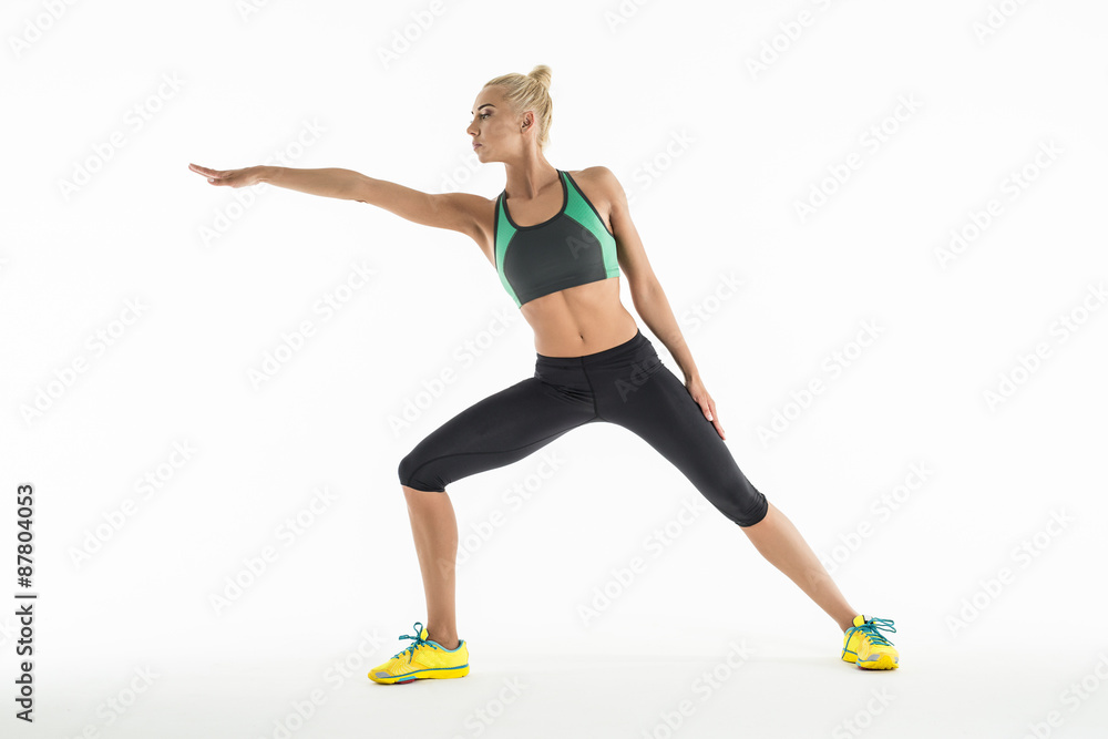 Rhythmic gymnast doing exercise in studio. Rhythmic gymnast doing exercise in studio.