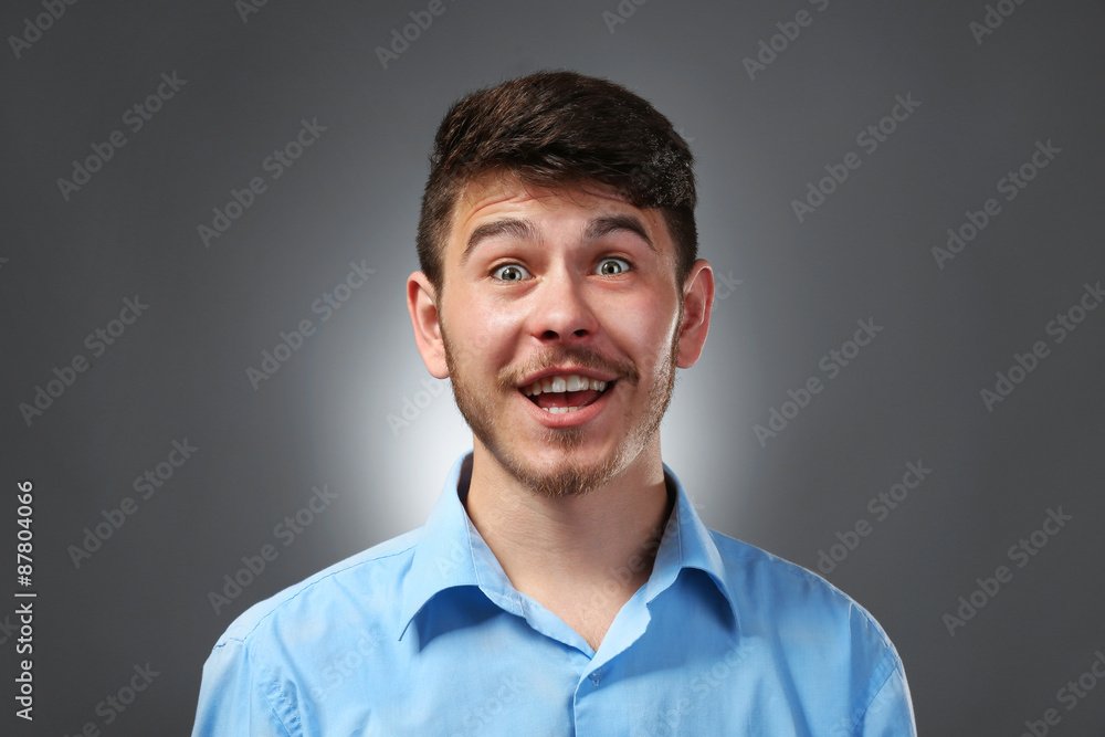 Portrait of surprised man on gray background Portrait of surprised man on gray background