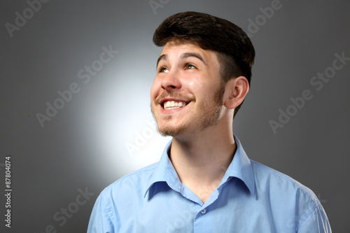 Portrait of smiling man on gray background
