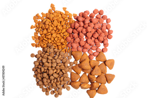 Dry dog food close up, isolated on white background