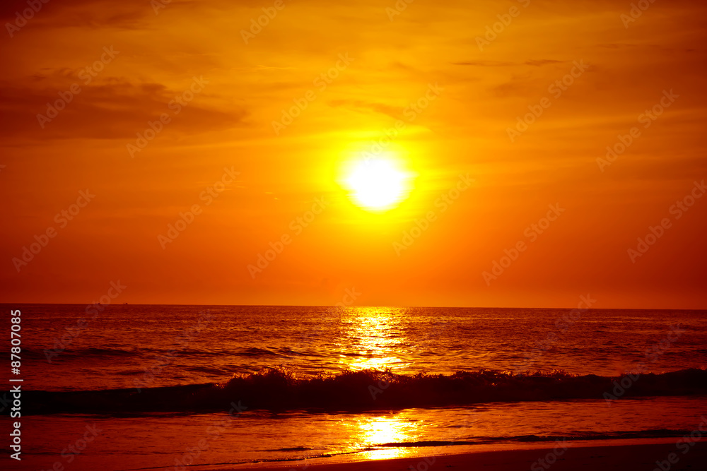 Sandy beach at golden sunset