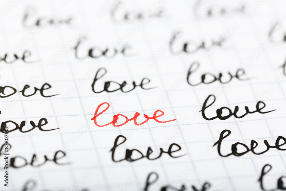 Words LOVE written on sheet of paper background Words LOVE written on sheet of paper background