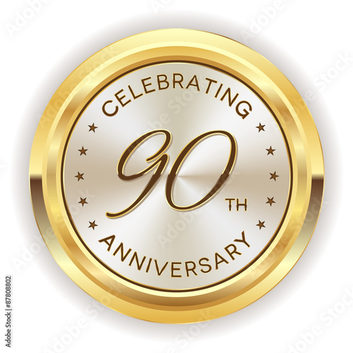 White 90th anniversary badge with gold border on white background