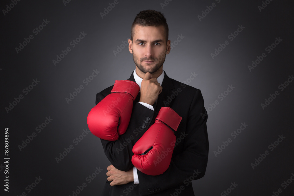 Businessman in boxing gloves Businessman in boxing gloves