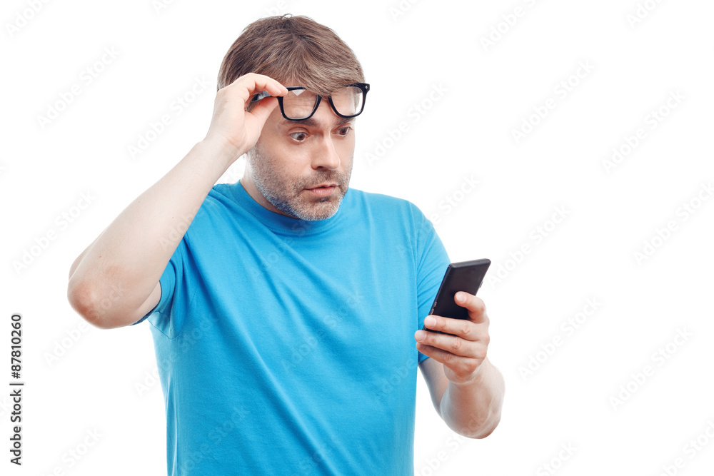 Handsome man holding mobile phone Handsome man holding mobile phone