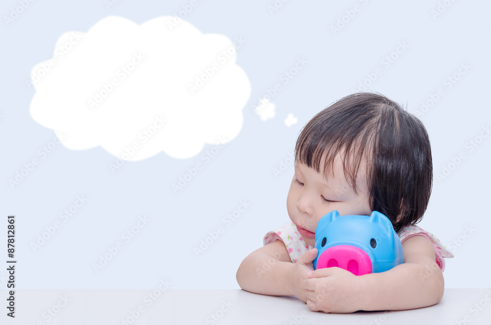 Asian girl smiling with piggy bank over white Asian girl smiling with piggy bank over white