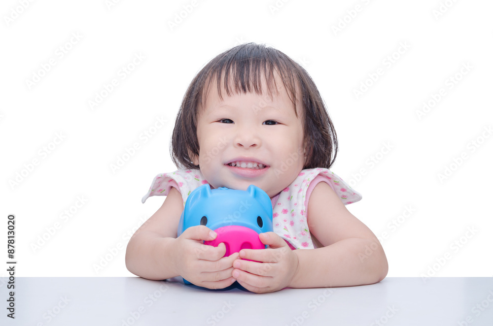 Asian girl smiling with piggy bank over white Asian girl smiling with piggy bank over white