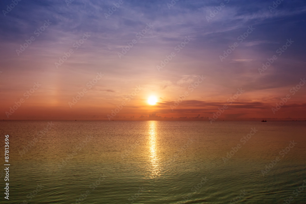 Sunset on the beach at Hua Hin, Thailand.