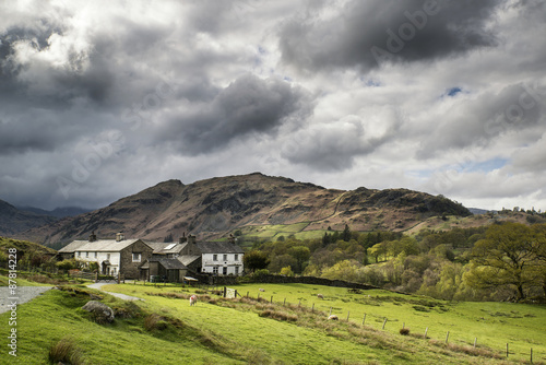 Beautiful old village landscape nestled in hills in Lake Distric photo