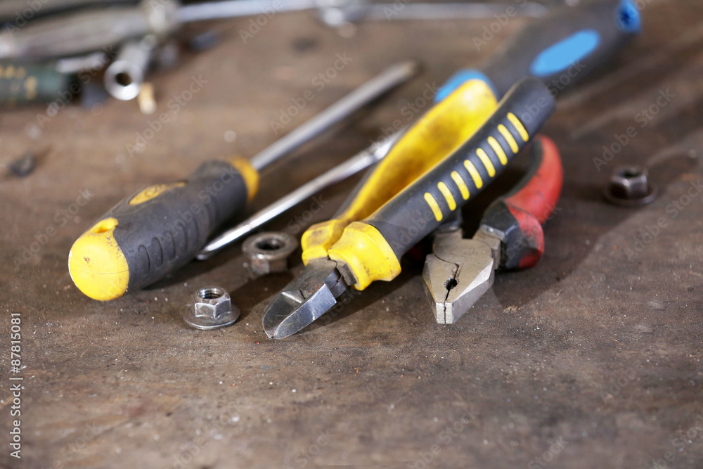 Different tools on workplace in garage Different tools on workplace in garage