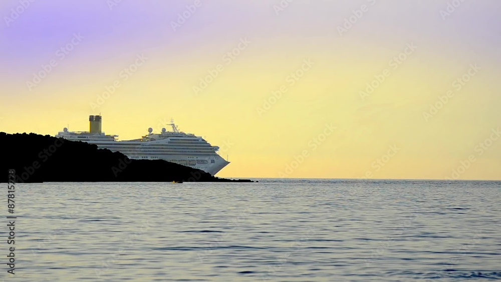 Luxury cruise ship sailing on ocean sunset horizon Luxury cruise ship sailing on ocean sunset horizon
